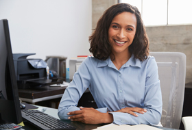 A female professional sits in her office.